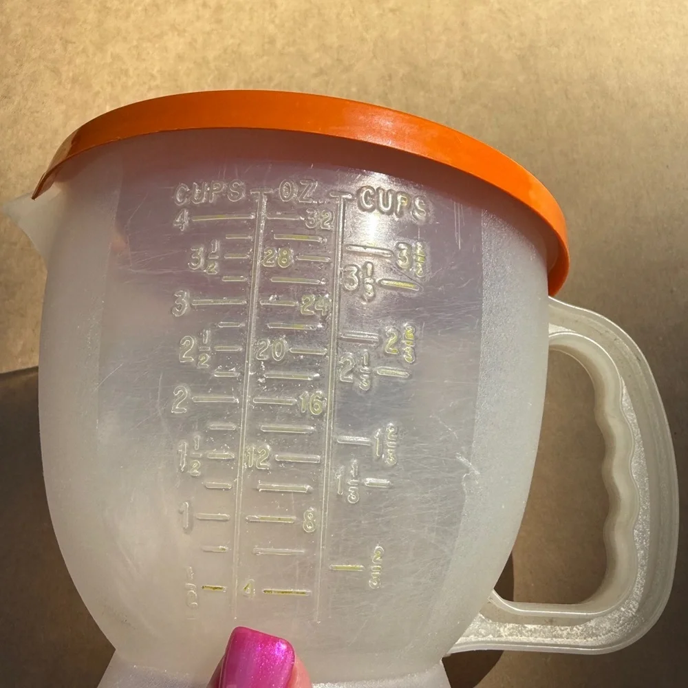Vintage Tupperware Orange Lidded Measuring Cup